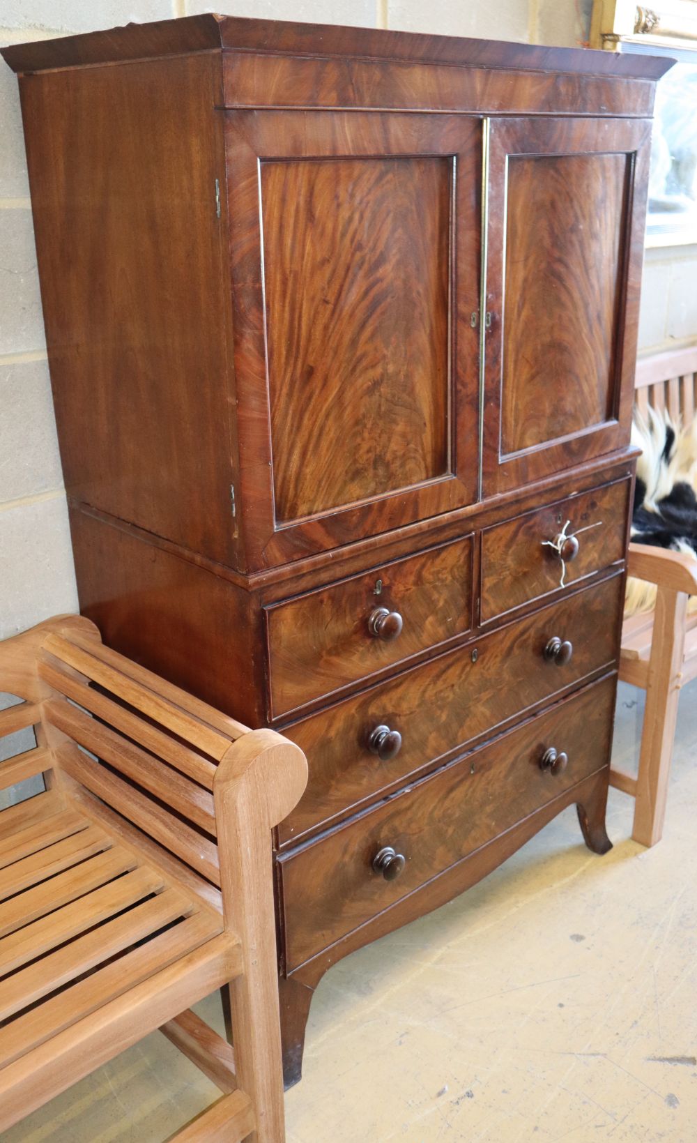 A small Victorian mahogany press cupboard on chest, W.94cm, D.52cm, H.156cm
